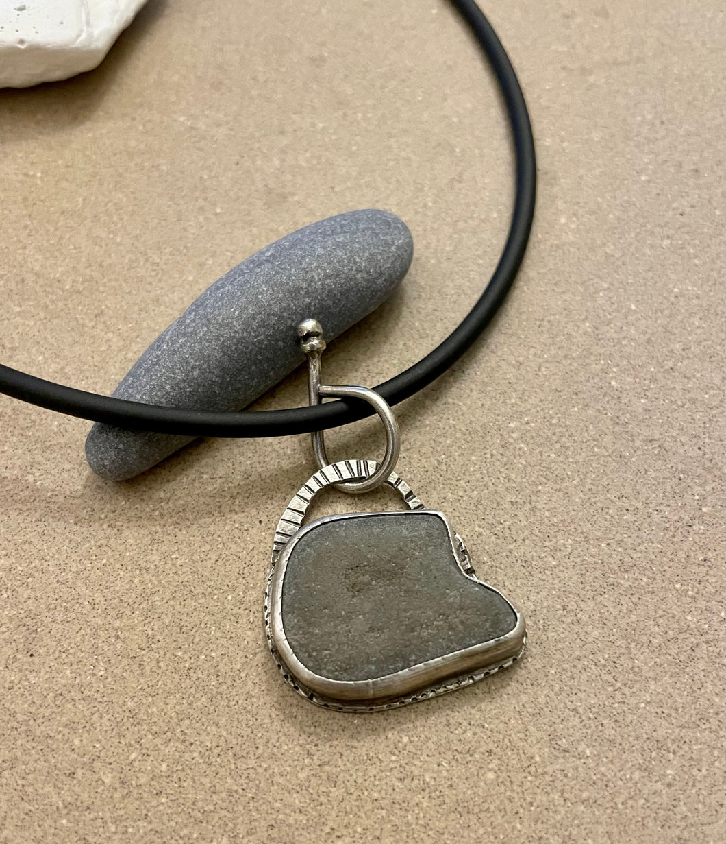 Repurposed Sterling Silver Grey Found Rock Pendant on Black Rubber